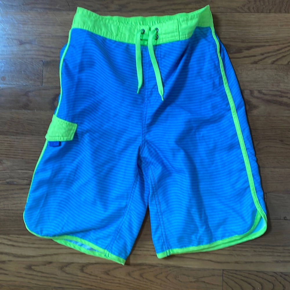 Swim trunks w/faux drawstring and inner drawstring to keep shorts in place.
